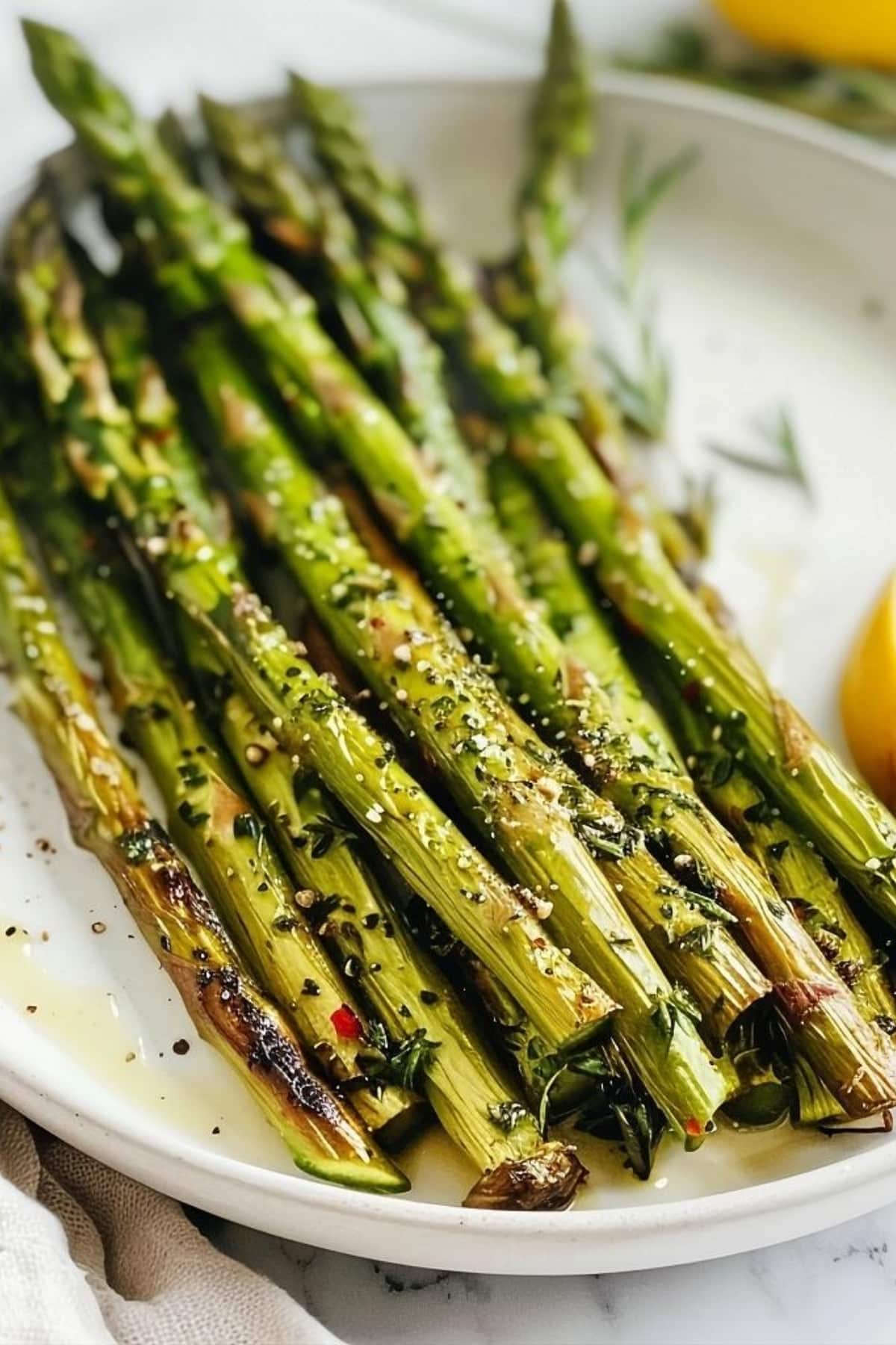 Air fried asparagus sprinkled with parmesan cheese.