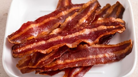 Air fryer turkey bacon on a white plate.