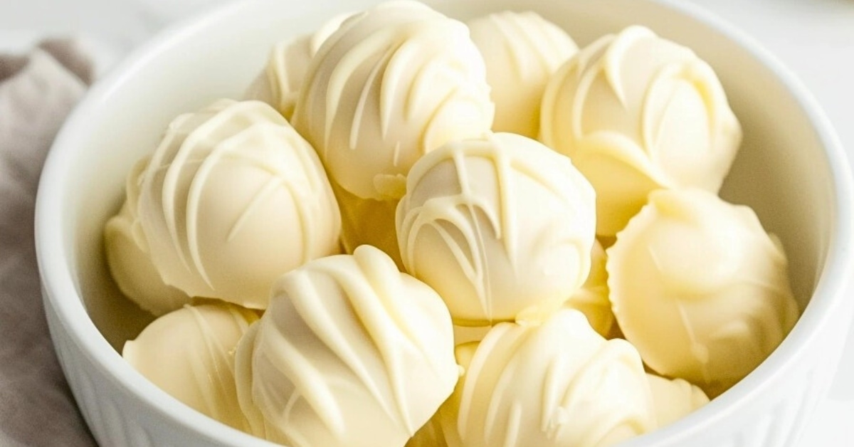 Bunch of white chocolate truffles on a bowl.