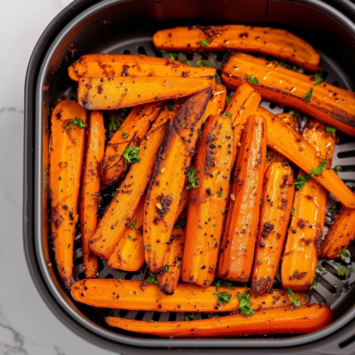 Carrots sticks inside air fryer