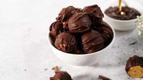 Bowl with chocolate covered peanut balls.