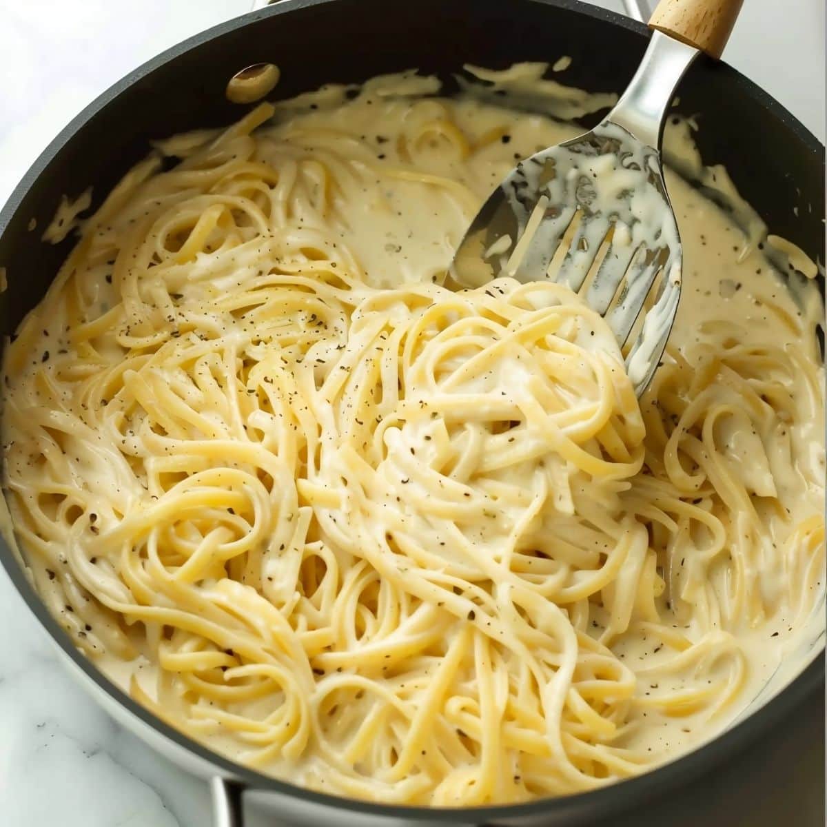 Homemade creamy pasta cooked in a pan