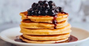 Fluffy pancakes with blueberry jam