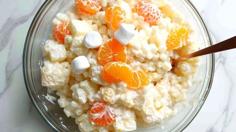Frog eye salad on a white marble table