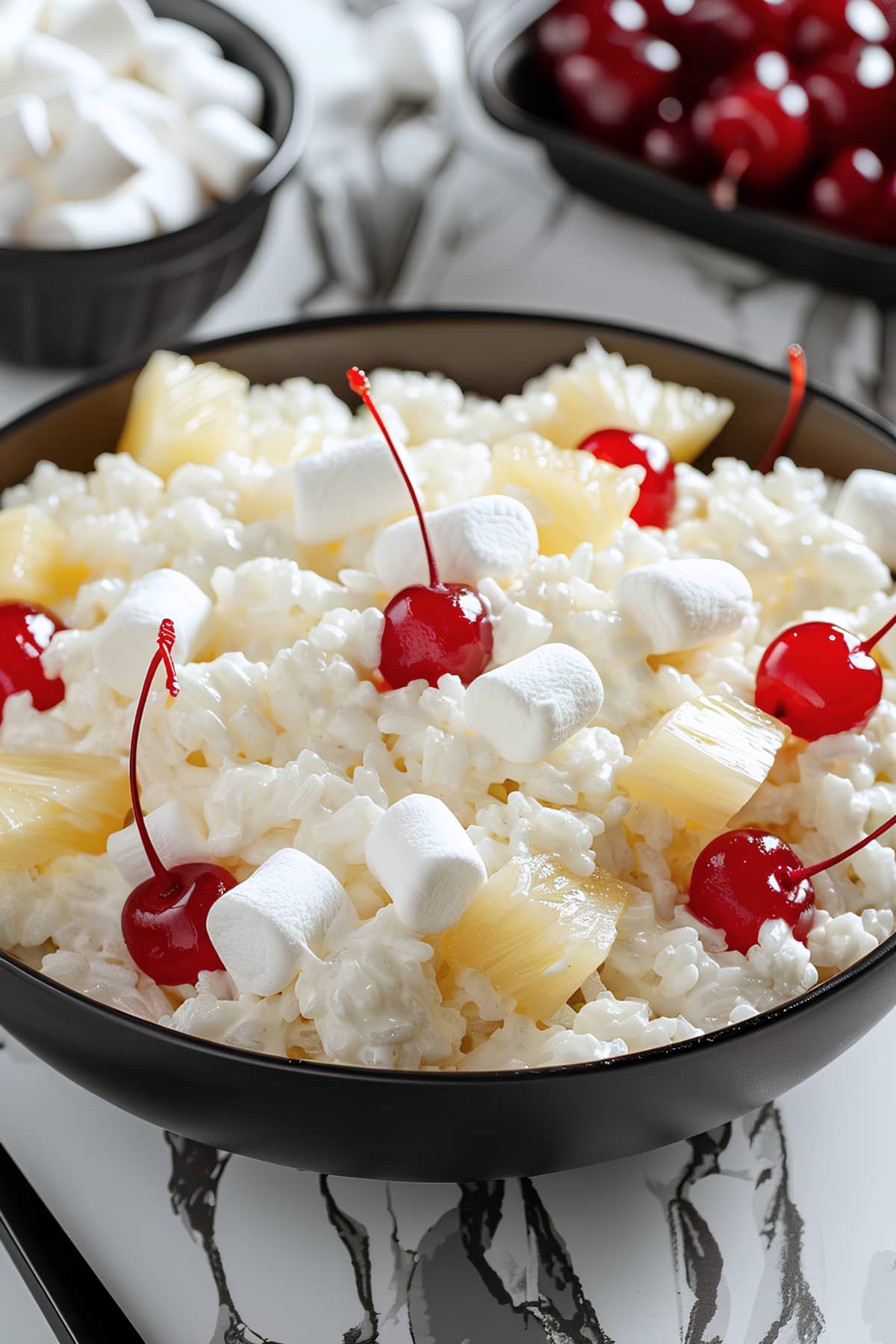 Fruity and creamy glorified rice with heavy cream, mini marshmallows, cherries and pineapple