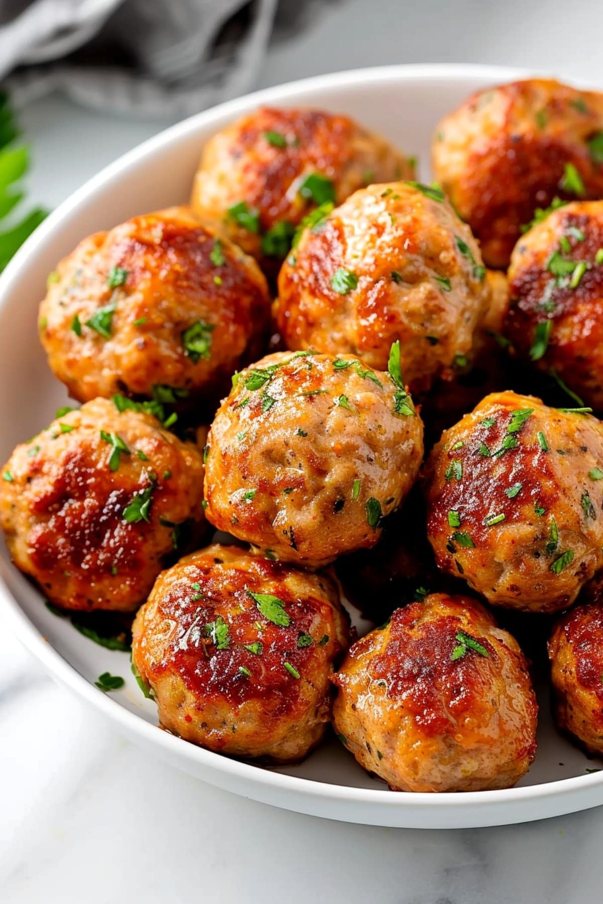 Turkey Meatballs in a White Bowl with Parsley