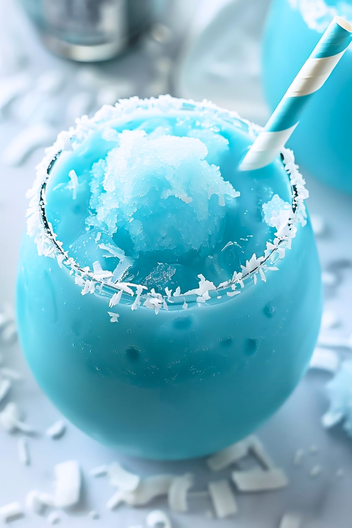 Jack Frost cocktail rimmed with shredded coconut