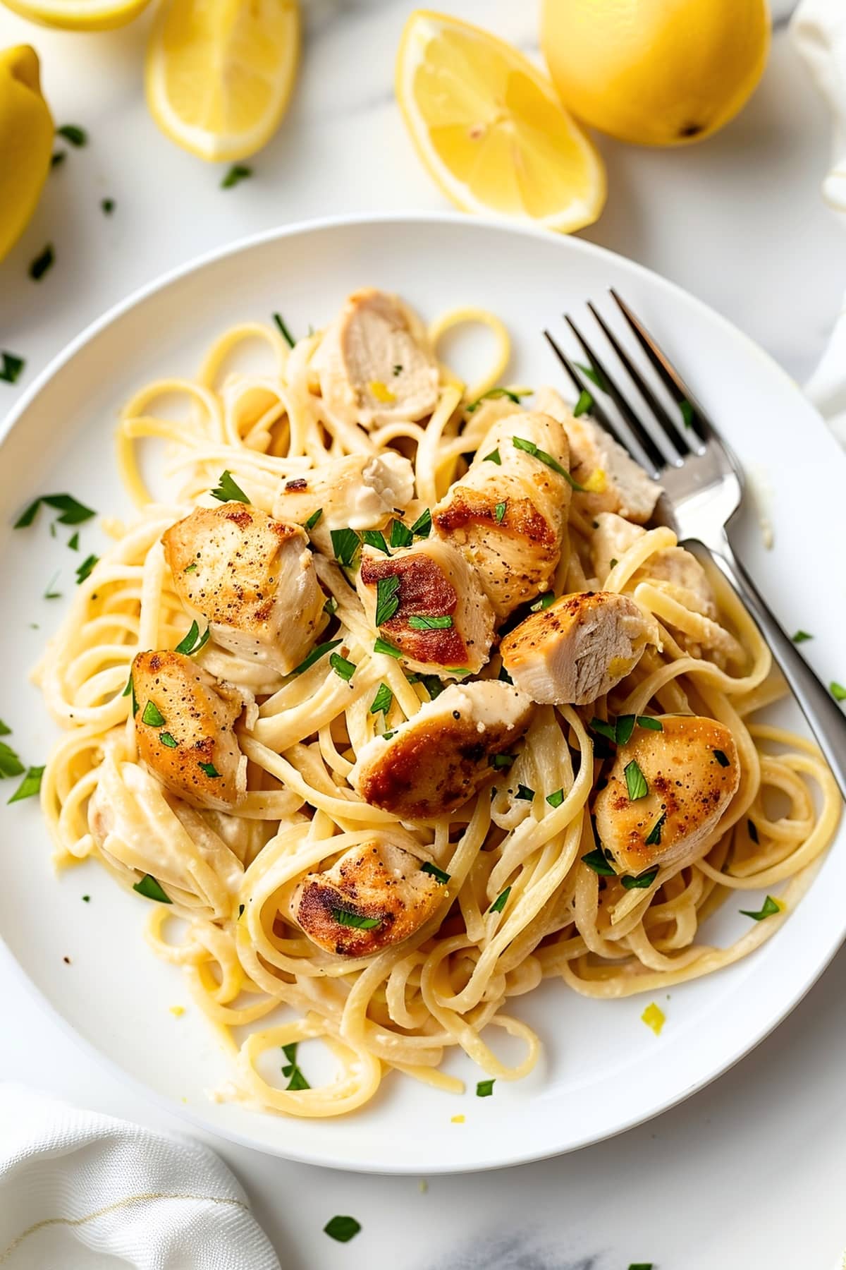 Delicious homemade lemon chicken pasta in a white plate