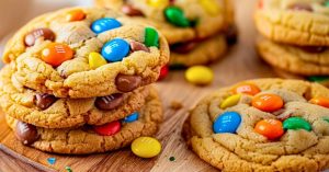 M&Ms cookies arranged in a wooden board.