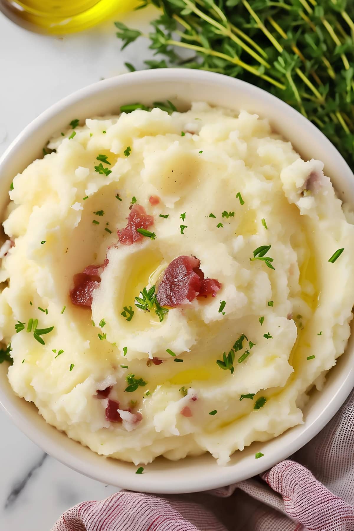 Mashed red potatoes with ham and herbs, top view