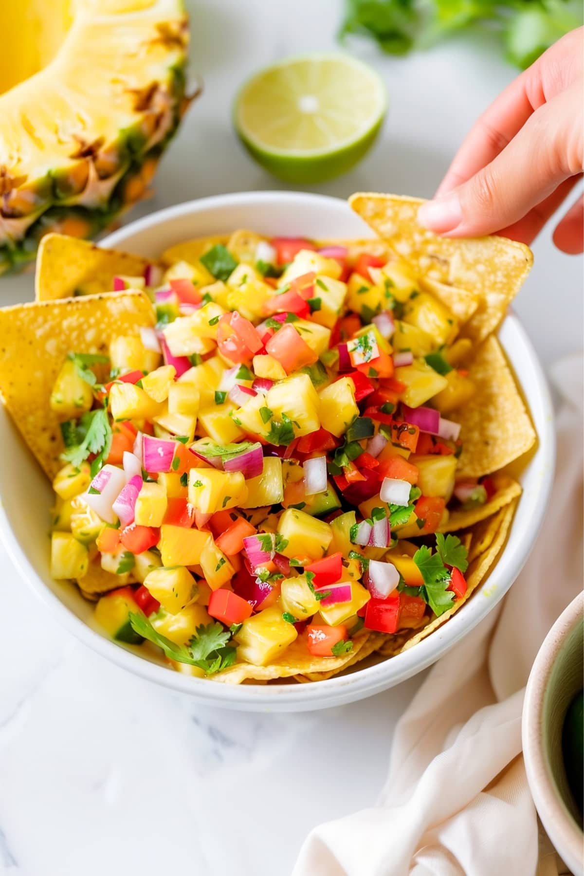 Pineapple salsa in a bowl with tortilla chips