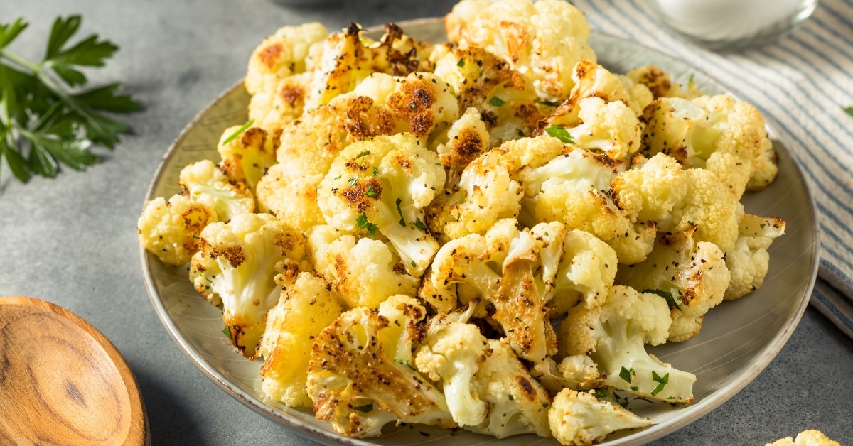 Roasted cauliflower served on a gray plate.