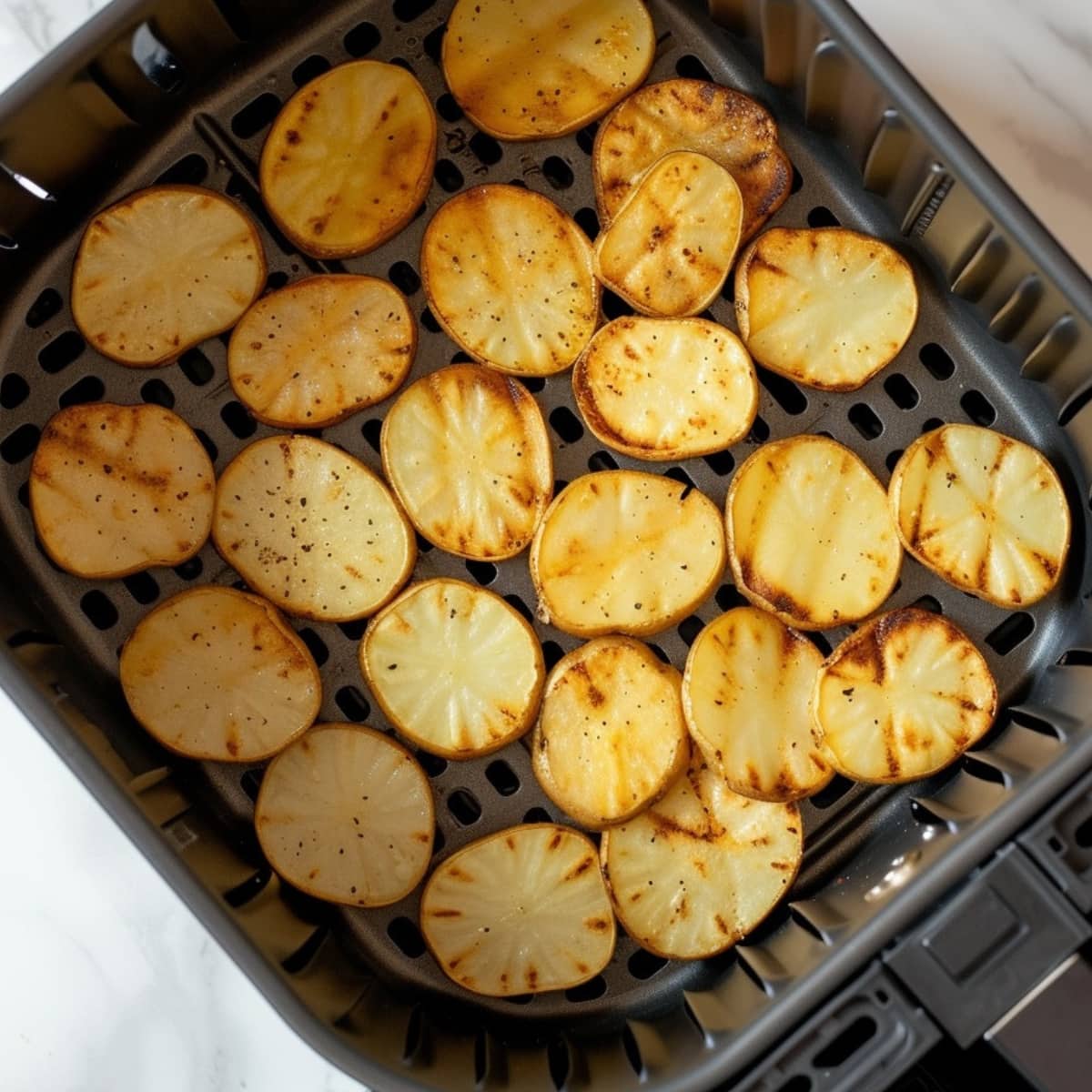 Potato chips inside an air fryer