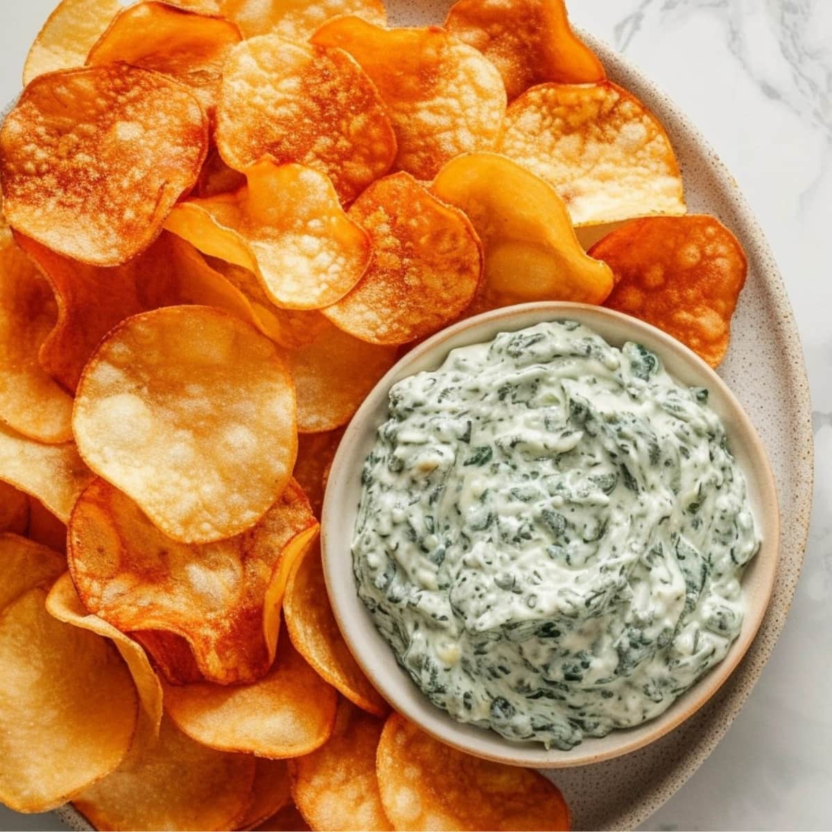 Potato chips with spinach dipping sauce.