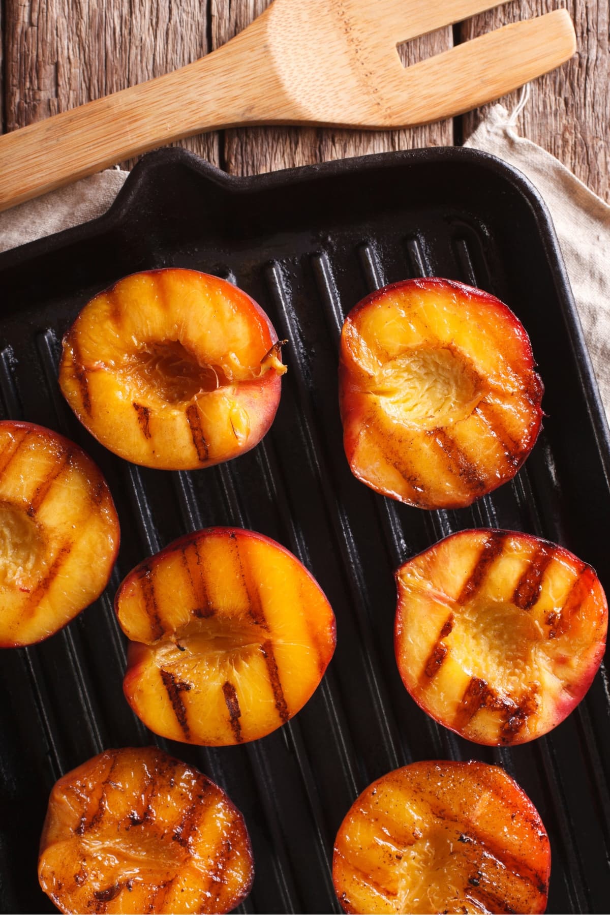 Ripe peaches grilled on a grilling pan