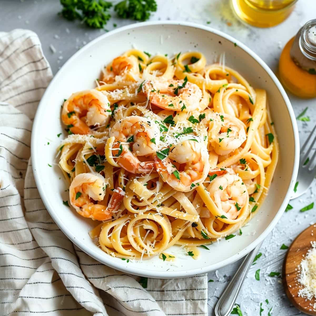 Homemade Juicy and tender shrimp linguine in a white bowl 