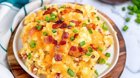Homemade cheesy crack potatoes with crispy bacon and green onions