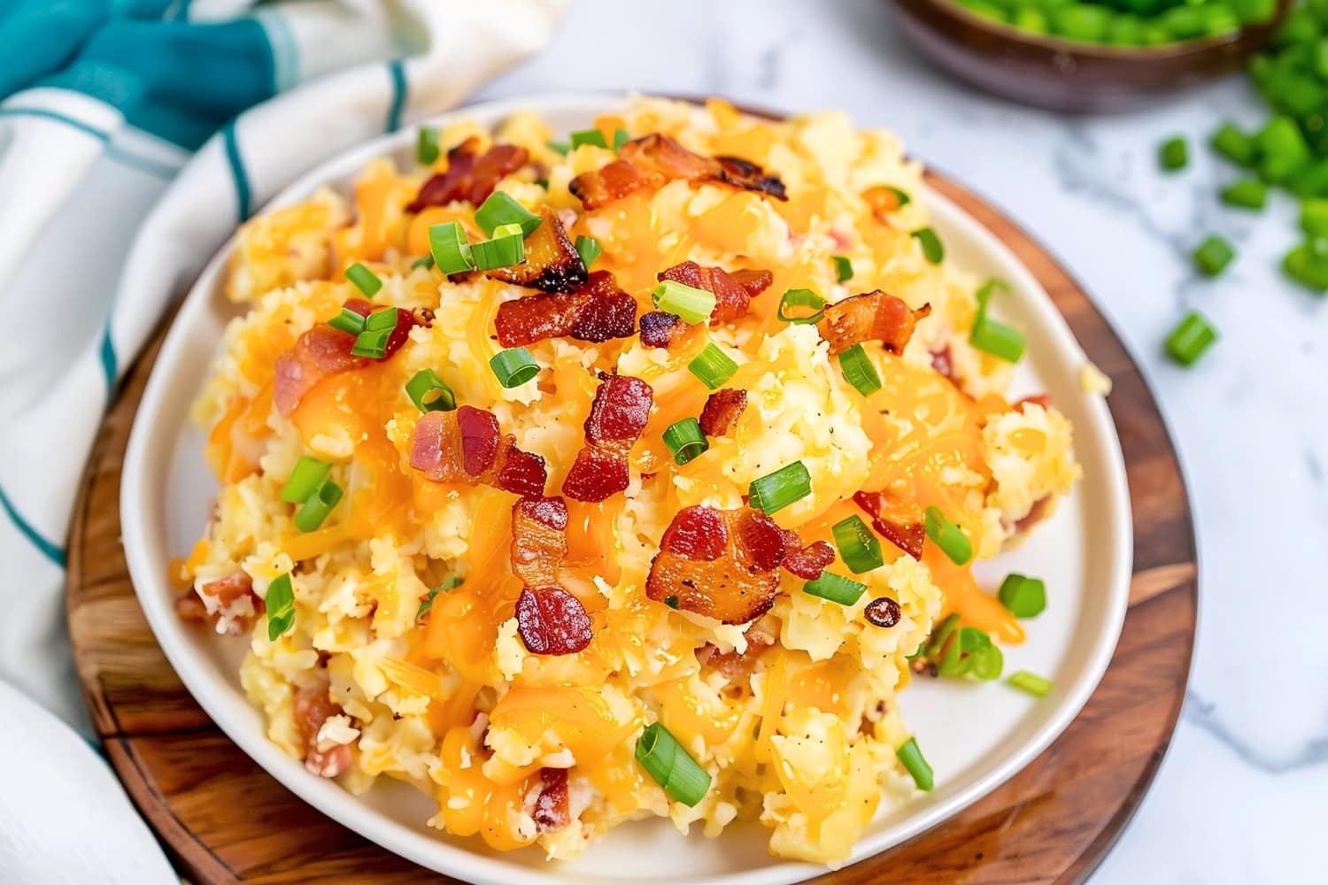 Homemade cheesy crack potatoes with crispy bacon and green onions