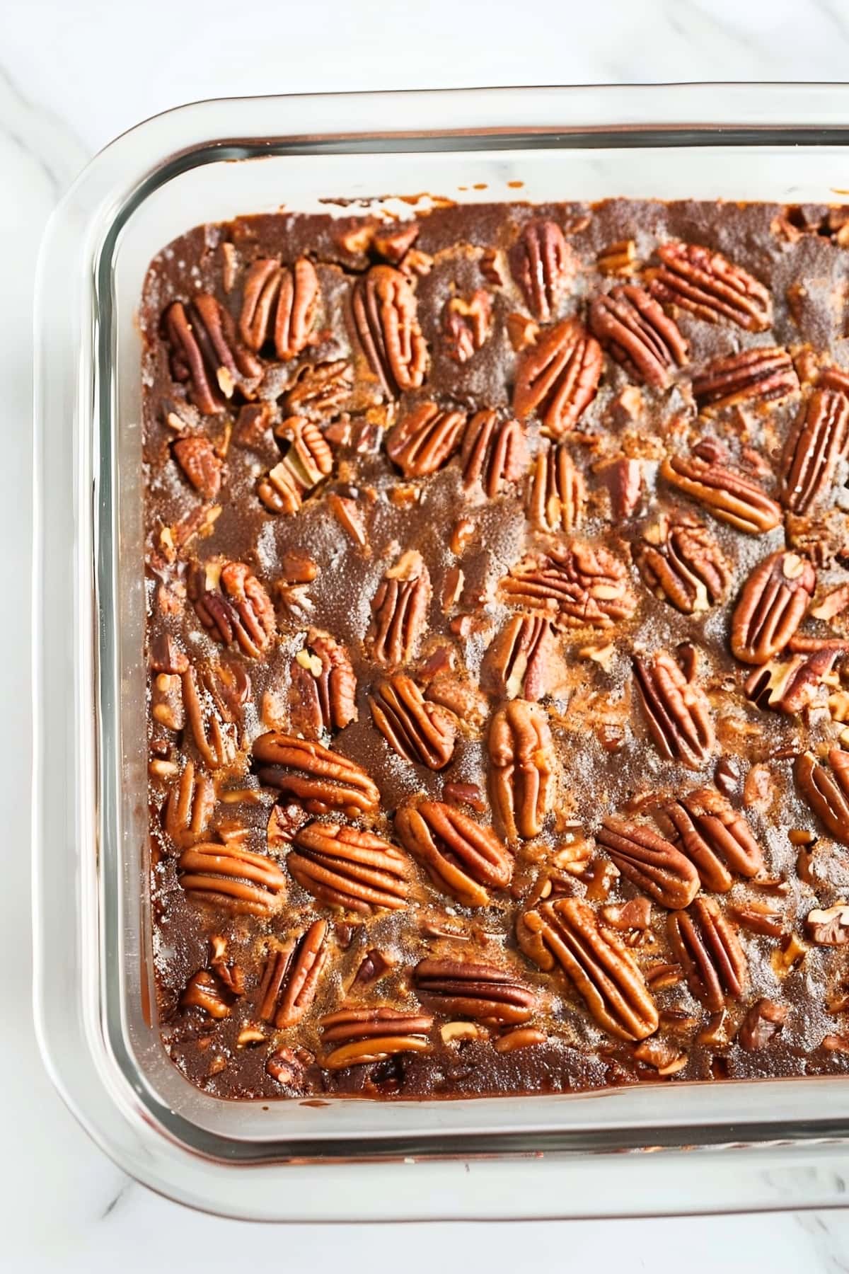 Whole pecan pie brownies in a glass baking dish