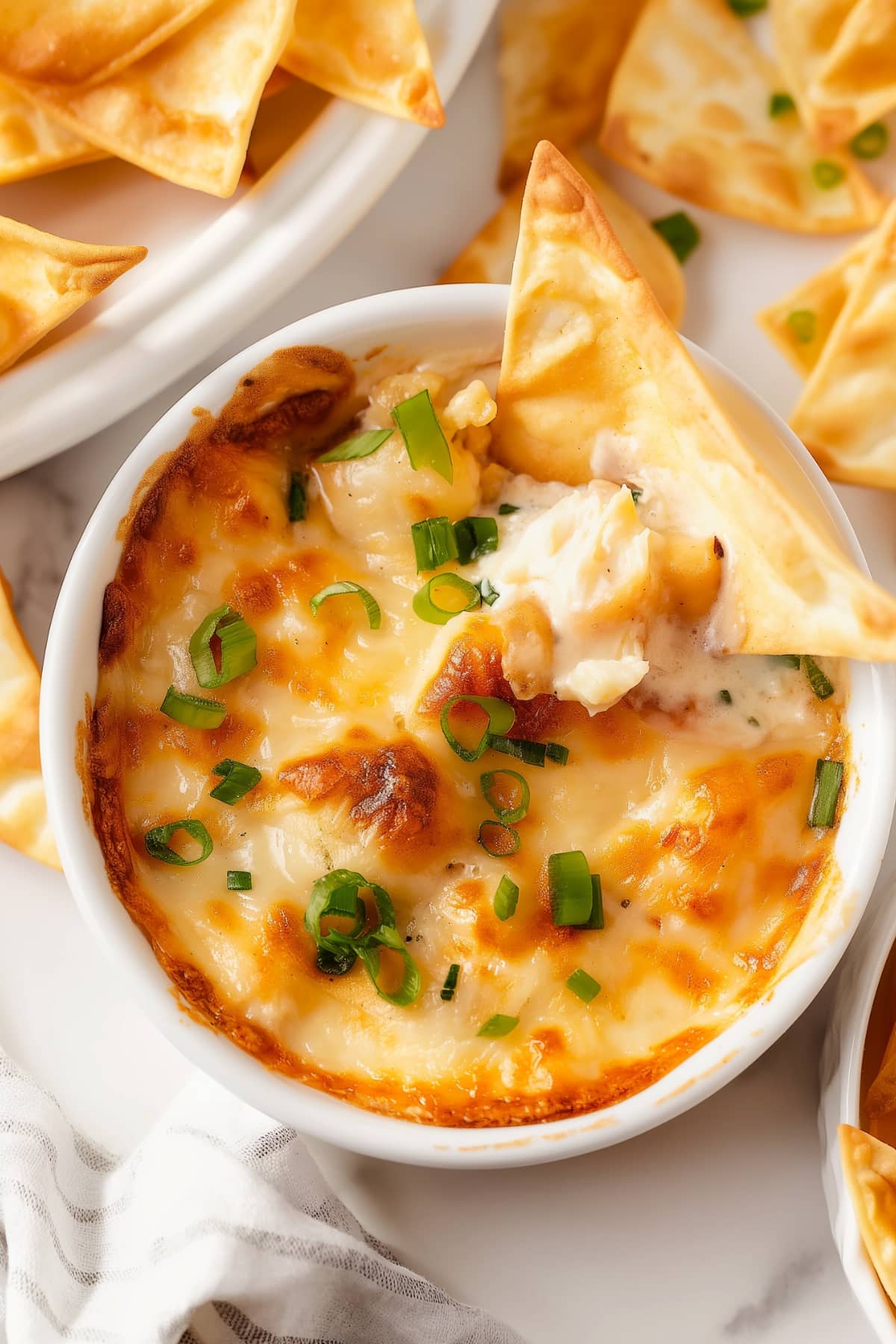 Overhead view of crab rangoon dip with wonton chips