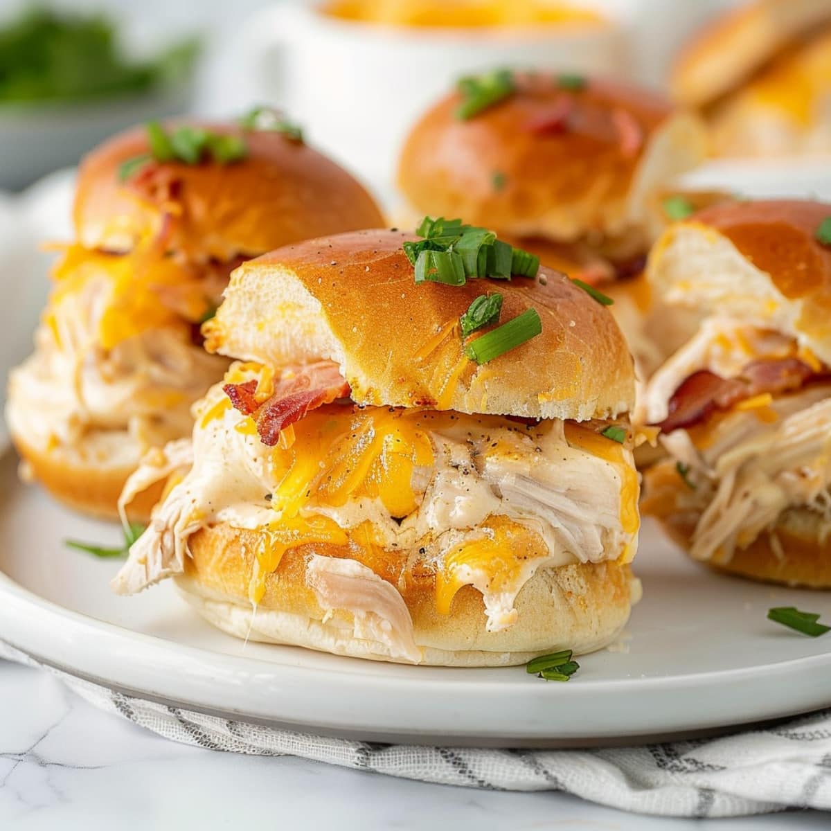 Crack chicken sliders sandwich with melted cheese, shredded chicken and bacon