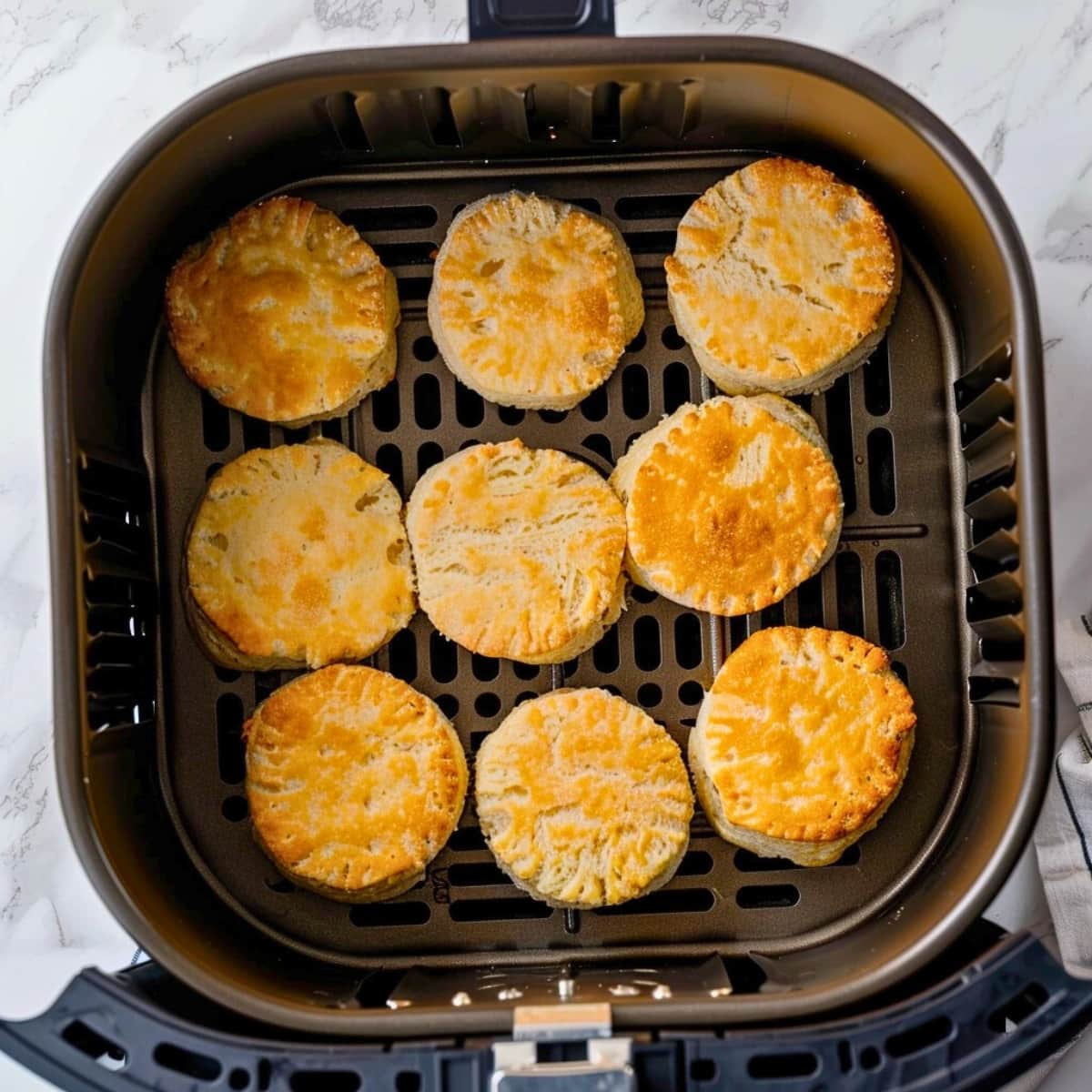 Biscuits inside an air fryer.