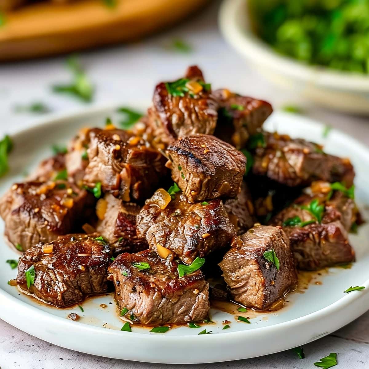 garlic butter steak bites seasoned with garlic and herbs, a mouthwatering dish bursting with flavor