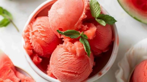 A bowl of homemade watermelon sorbet with a hint of mint