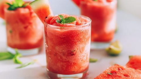 Three glasses of cool and refreshing watermelon slushie with a hint of mint and lime juice