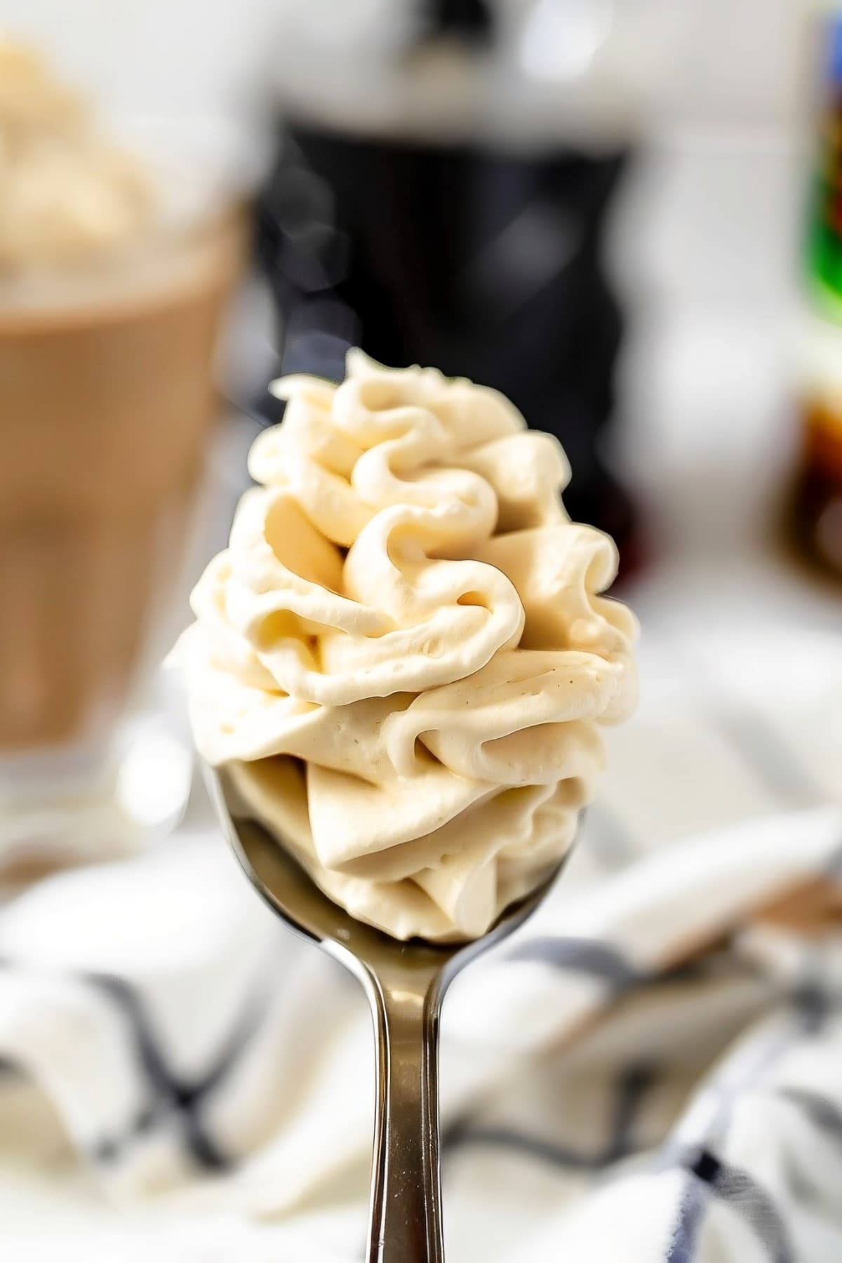A dollop of creamy and silky Kahlua whipped cream in a spoon
