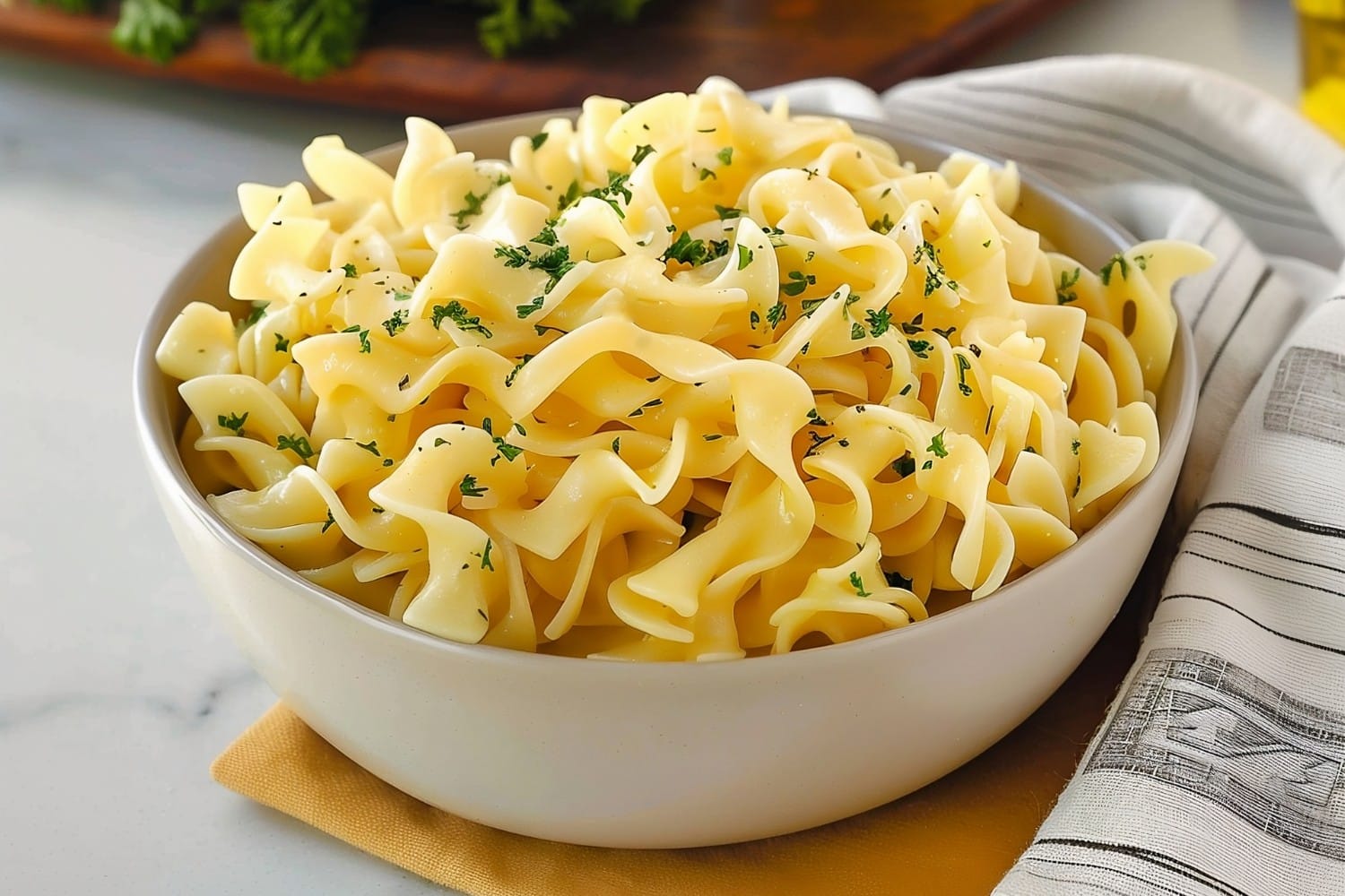 Mouthwatering Amish egg noodles topped with parsley in a white marble countertop