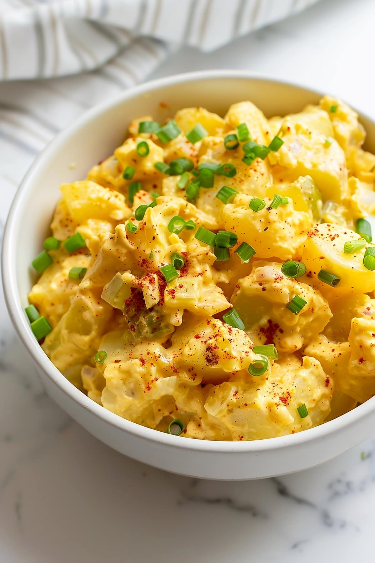 Hearty Southern potato salad, boasting a blend of mayonnaise, mustard, and vinegar for tangy flavor