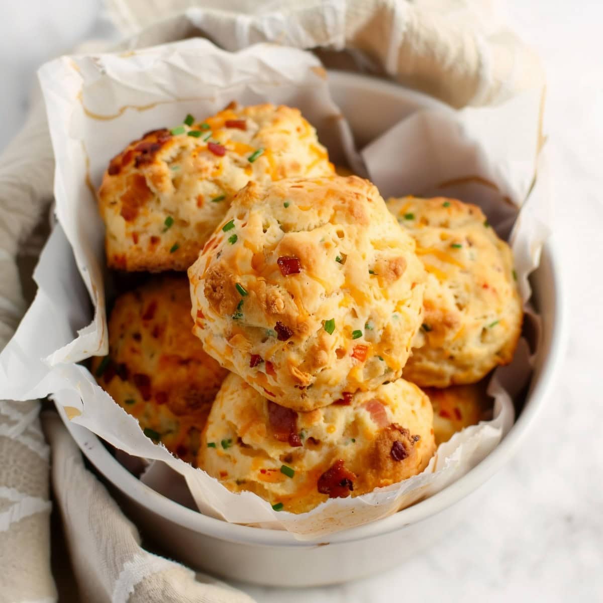 Bacon, cheese and chives biscuits, with crispy edges and a soft, fluffy interior