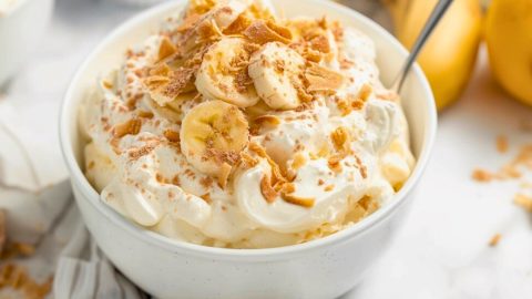 Fluffy pudding with banana slices in a bowl.