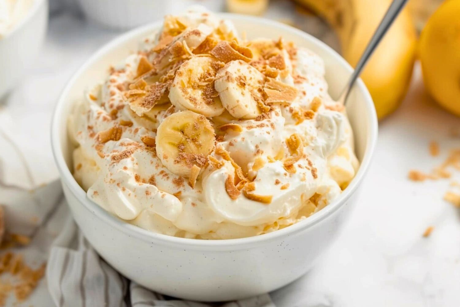Fluffy pudding with banana slices in a bowl.