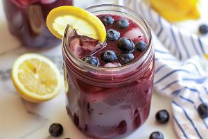 Zesty lemonade infused with the sweetness of ripe blueberries, a burst of flavor in every sip