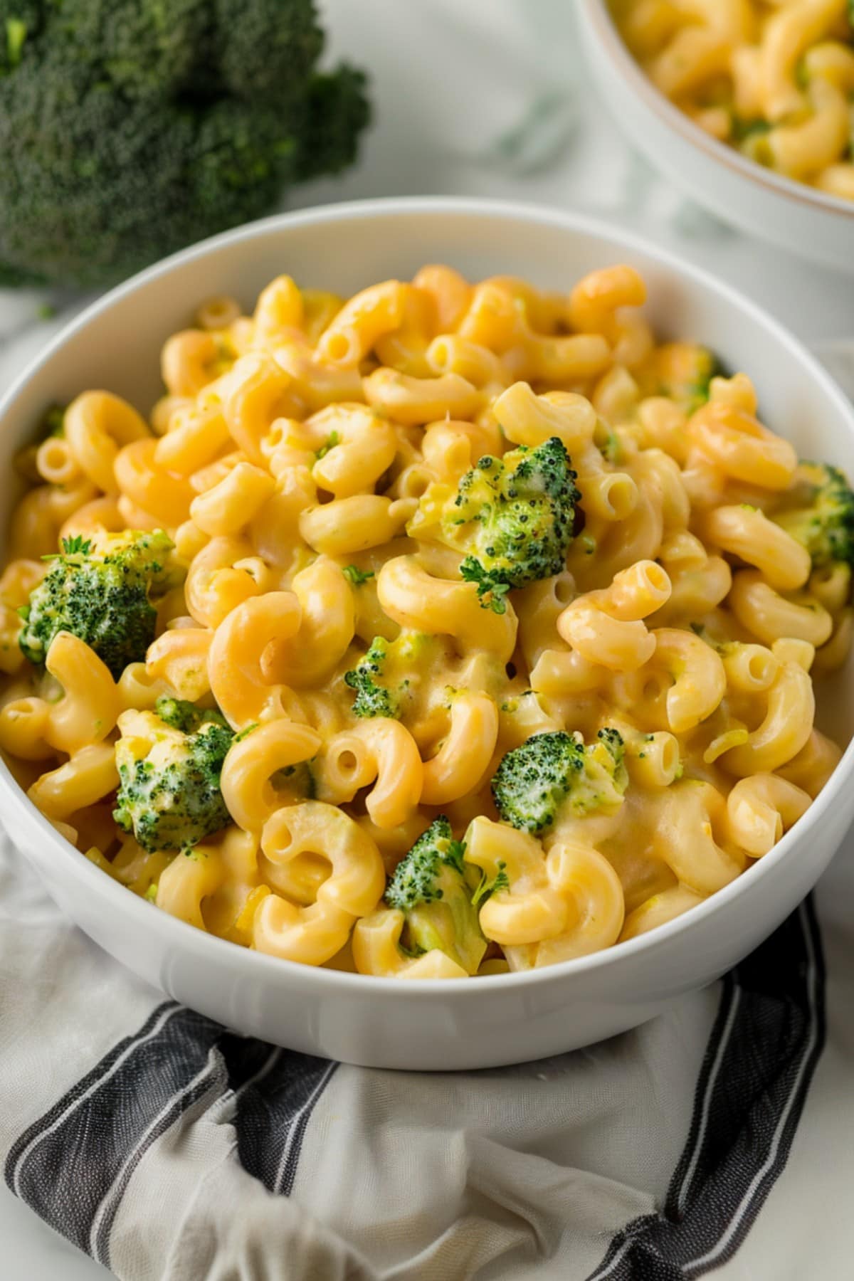 Irresistible broccoli cheddar mac and cheese in a bowl, bubbling with cheesy goodness