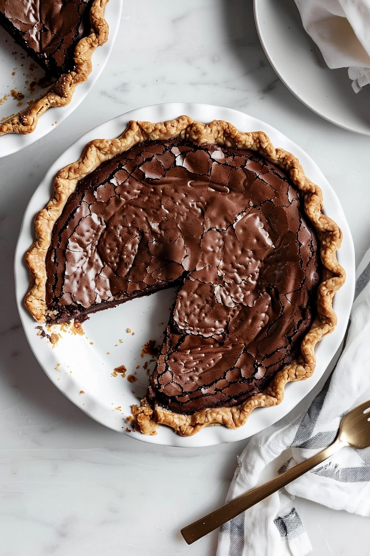 Irresistible brownie pie with a crackly top and a melt-in-your-mouth chocolatey center