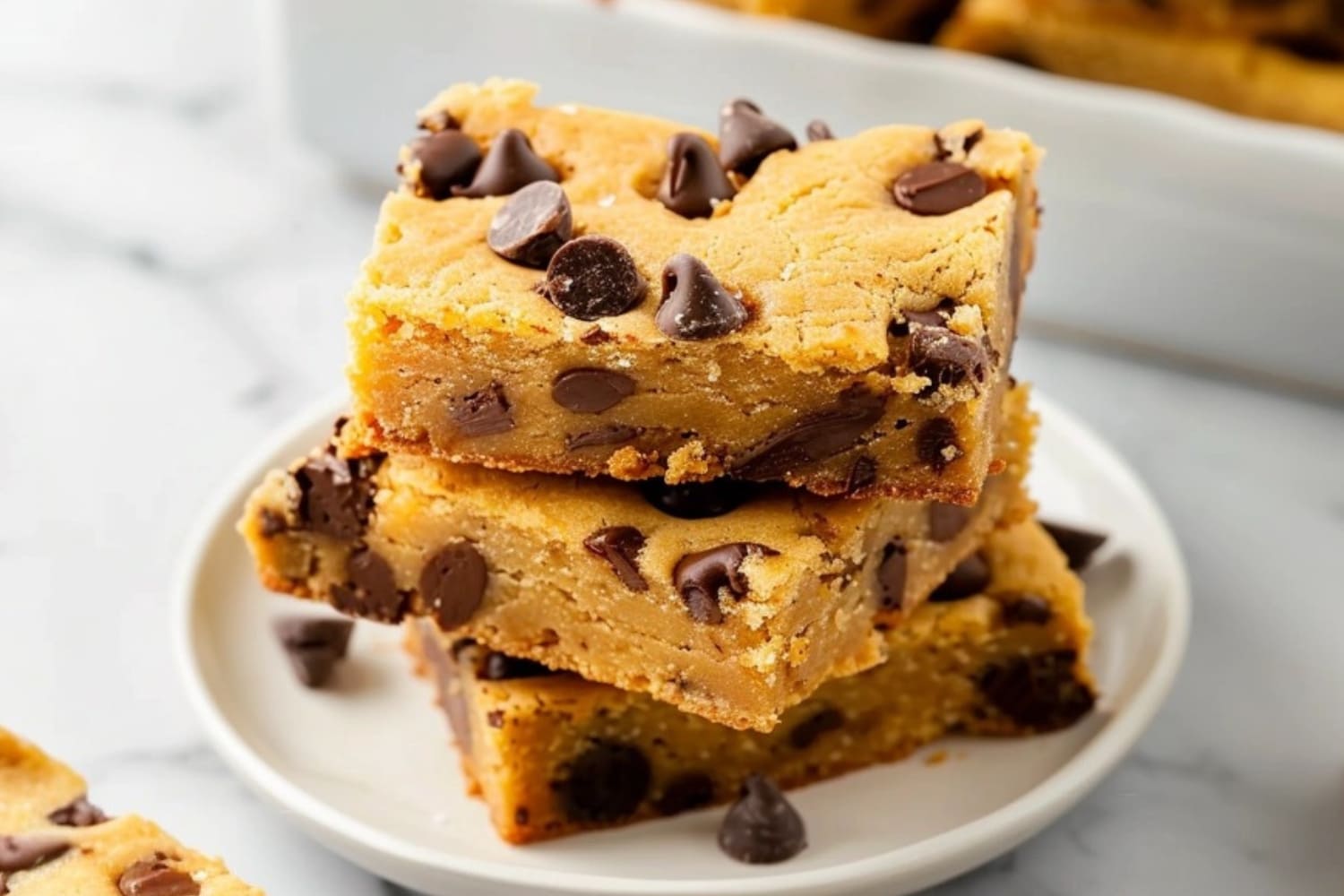 Cake mix cookie bars square slices stack on a small plate.