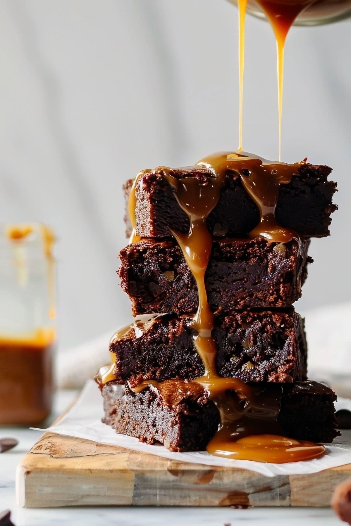 Stack of Caramel Brownies with Caramel Syrup dripping down the side