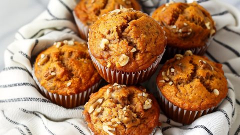 Flavorful carrot muffins, featuring a blend of warm spices and a touch of crunchy nuts