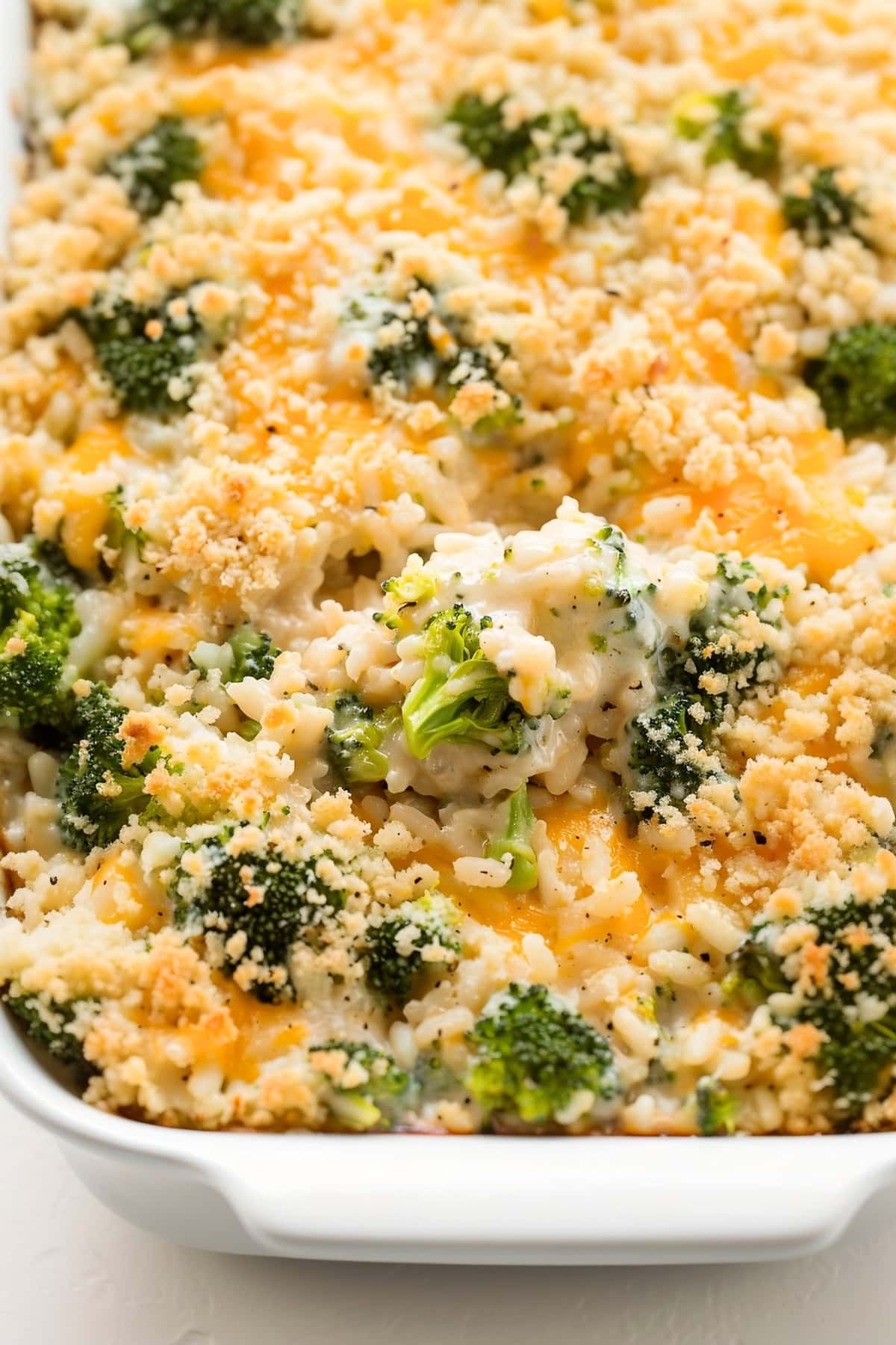 Homemade broccoli rice casserole with a golden breadcrumb topping, fresh from the oven