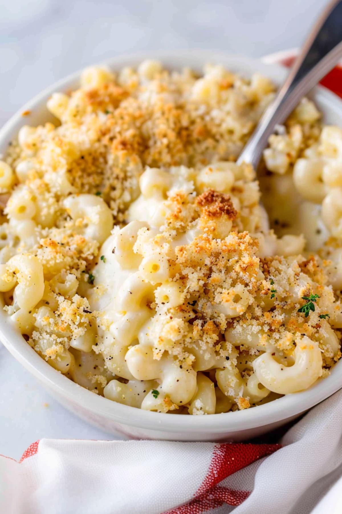 Homemade white cheddar mac and cheese, bubbling with gooey cheese and baked to perfection