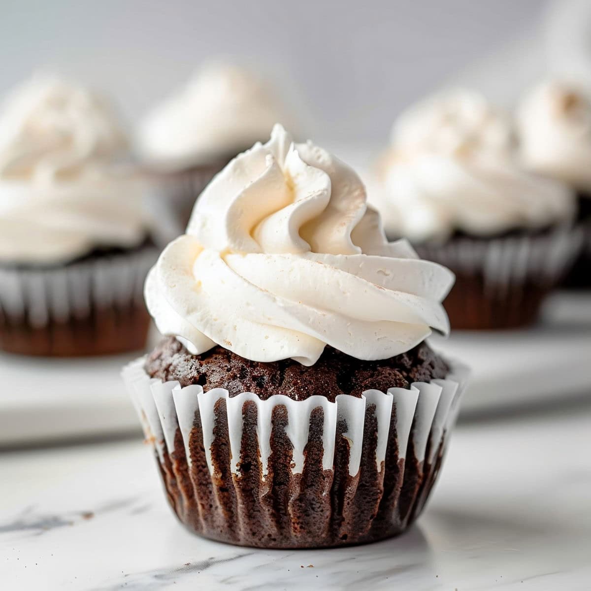 Sweet chocolate cupcakes topped with swirling marshmallow fluff