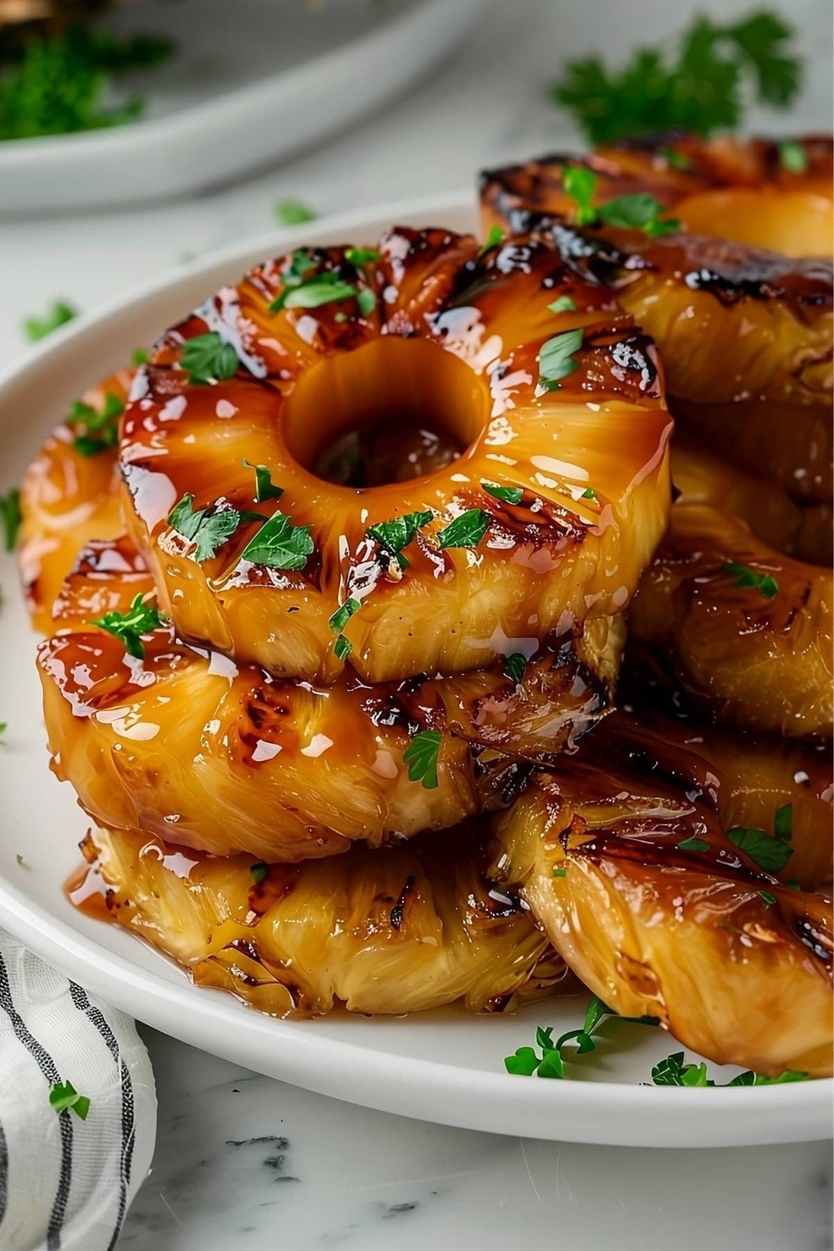 Glazed grilled pineapple rings in a grill pan
