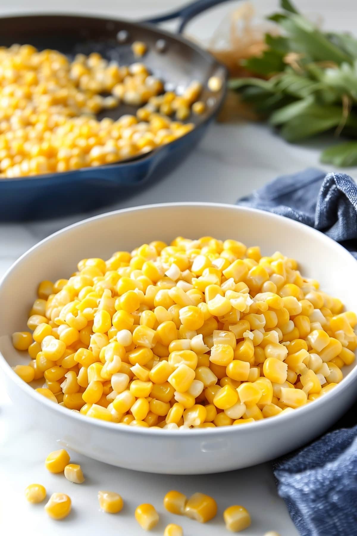 Golden honey butter corn skillet, featuring plump creamy kernels in a white bowl