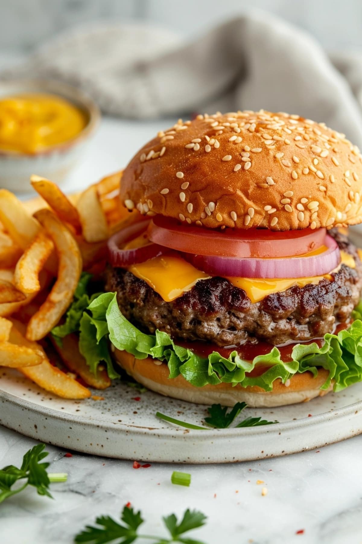 Crack burger with thick patty, sliced tomato, red onions, sliced cheese and lettuce served with fries.
