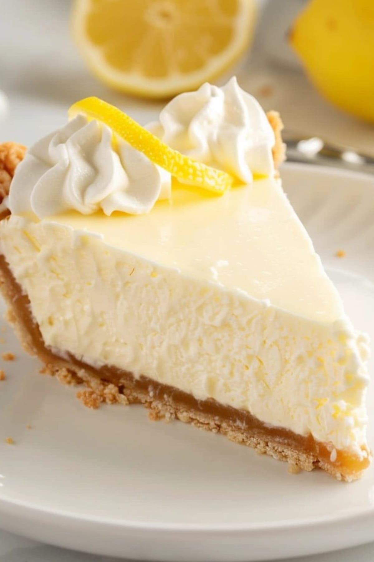 Cream Cheese Lemonade Pie slice in a white plate garnished