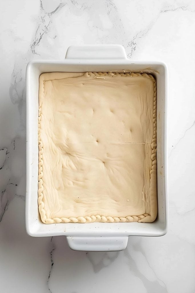 Crescent dough flat lay in baking dish.