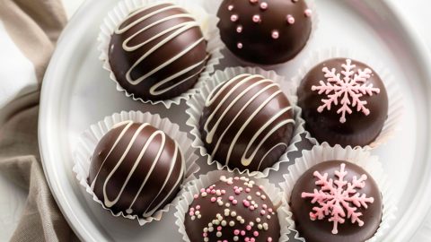 Homemade decorated hot chocolate bombs filled with cocoa mix powder and mini-marshmallows